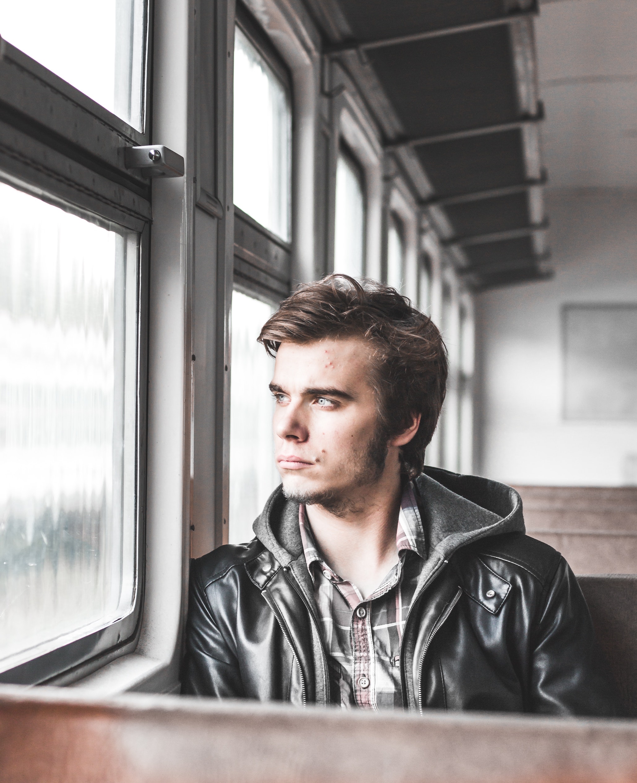 Man looking out bus window